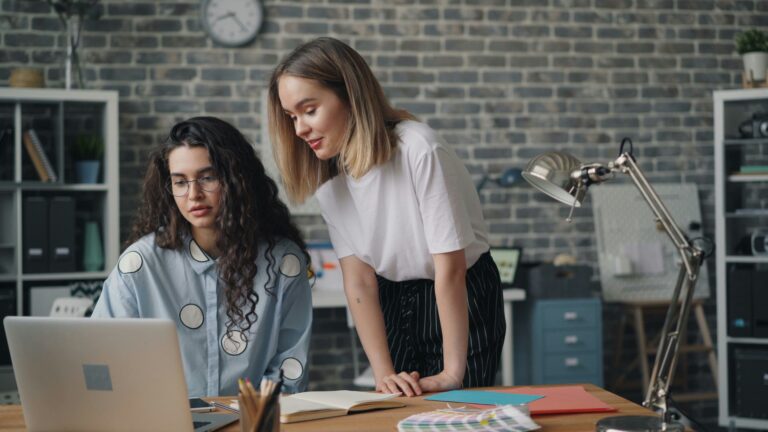 2 women figuring out procurement strategies